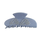 A single light blue claw clip with "Be Be" lettering made of pearl-like studs.