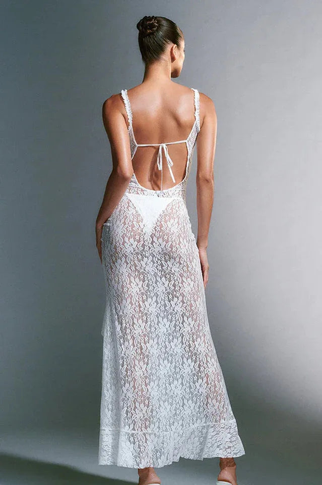 back view of a white lace maxi dress with a low tie back