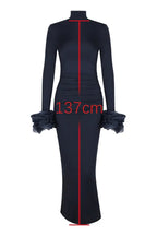 Flat lay of a navy blue long-sleeved column gown with measurement indicating a length of 137cm.