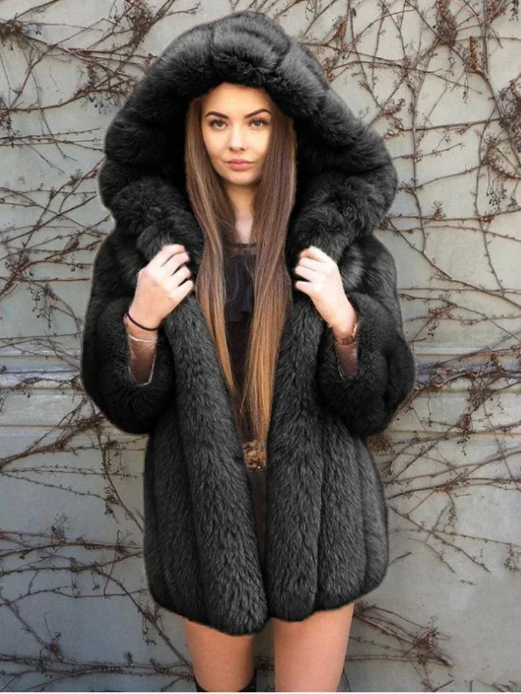 Woman wearing a black faux fur hooded coat