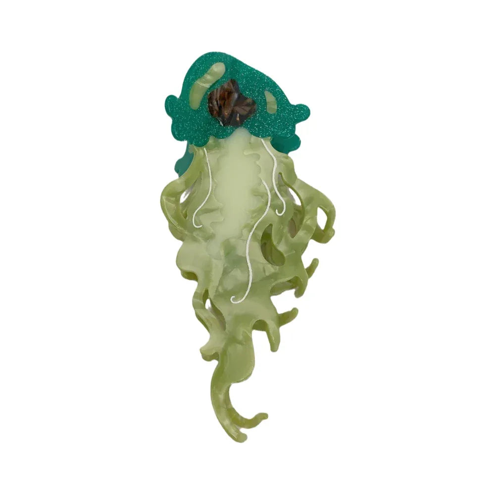 Green glitter jellyfish hair clip with translucent tentacles and white swirls