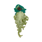 Green glitter jellyfish hair clip with translucent tentacles and white swirls