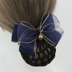 navy blue hair bun cover with a navy sheer organza bow with gold trim and charm