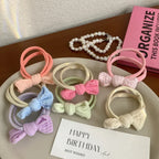 pastel bow hair ties arranged on a plate