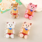 Collection of four iridescent bear-shaped hair claw clips in different colors (brown, pink, white, peach)
