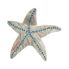 White marbled starfish hair clip with blue dots and "sea star" text