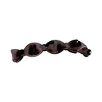 a single brown and black marbled candy-shaped hair clip