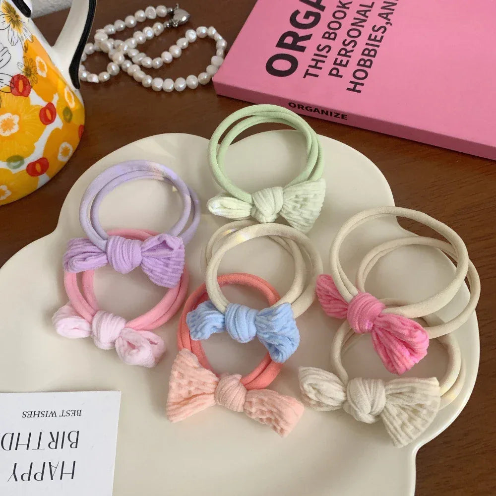close-up of pastel bow hair ties
