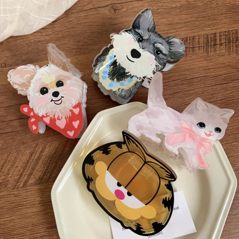 Collection of cute animal hair clips with Garfield, a schnauzer, a terrier, and a cat