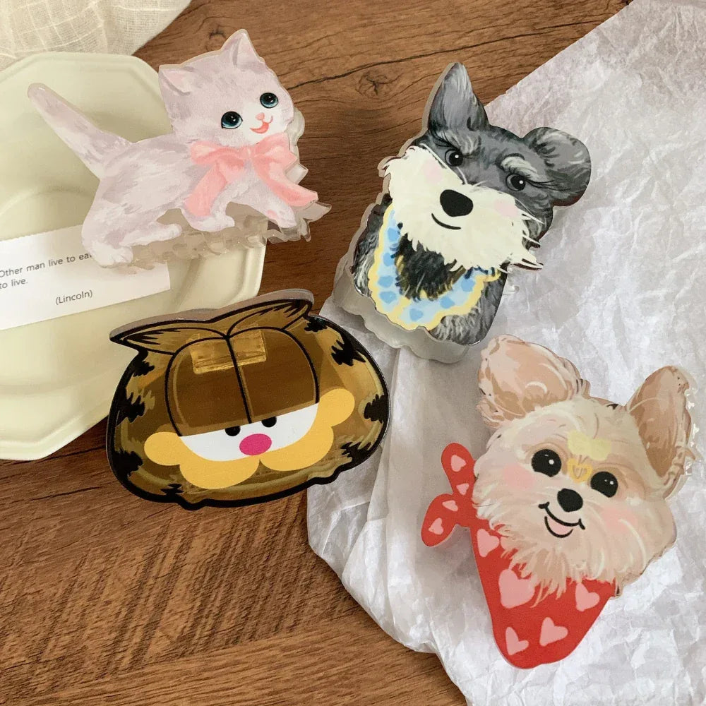 Assortment of cartoon character hair accessories featuring Garfield, a cat, and two dogs