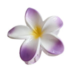 A purple and white plumeria flower hair clip with a glossy finish.