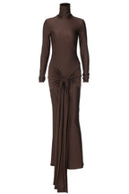 A long-sleeved, brown, mock neck, floor-length dress with a draped knot detail at the waist, displayed on a white background.