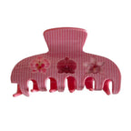 Pink striped claw clip with floral designs