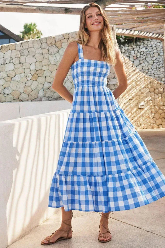 Woman wearing a blue gingham tiered maxi dress