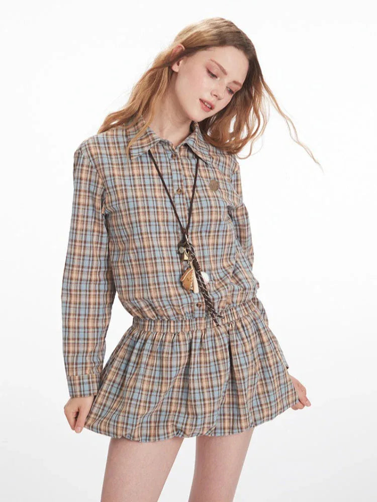 Model posing in a plaid shirt dress
