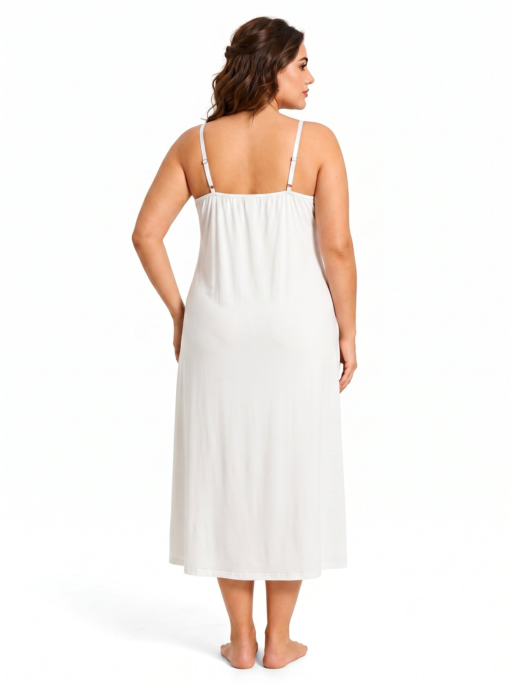 Back view of a woman wearing a white satin slip dress