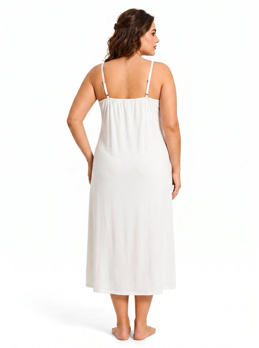 Back view of a woman wearing a white satin slip dress