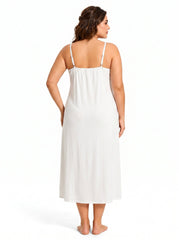 Back view of a woman wearing a white satin slip dress