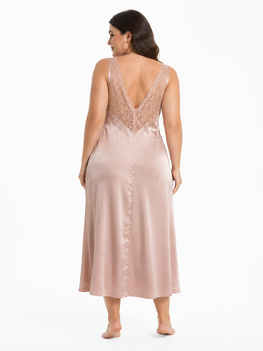 Back view of a woman in a pink satin midi slip dress with a deep V-neck lace detail