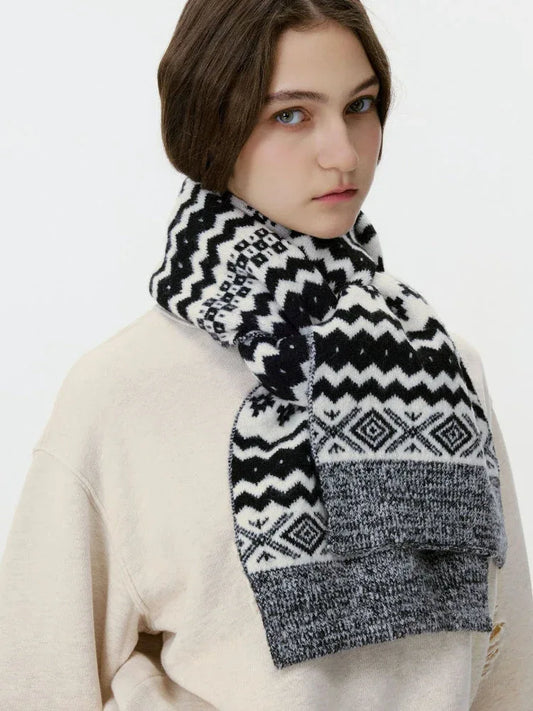 Woman wearing a black and white Fair Isle knit scarf