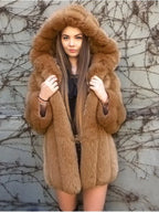 Woman wearing a brown faux fur hooded coat