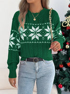 woman wearing green snowflake print knit sweater with jeans and gold necklace