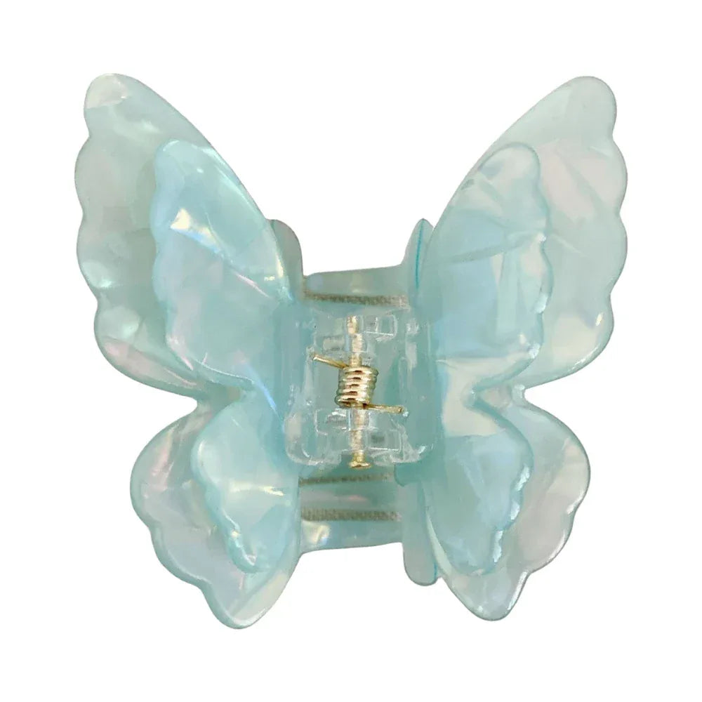 Close-up of a light blue iridescent butterfly claw clip with a gold spring Main image