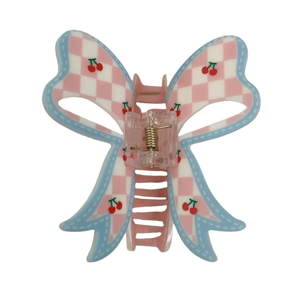 Pink and blue checkered bow hair clip with cherry print Main image