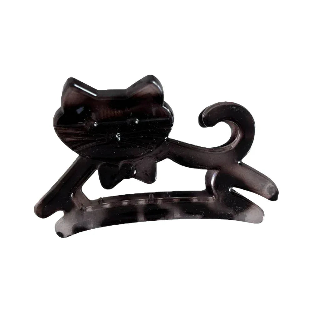 A black cat-shaped hair claw clip with a bow tie detail.
