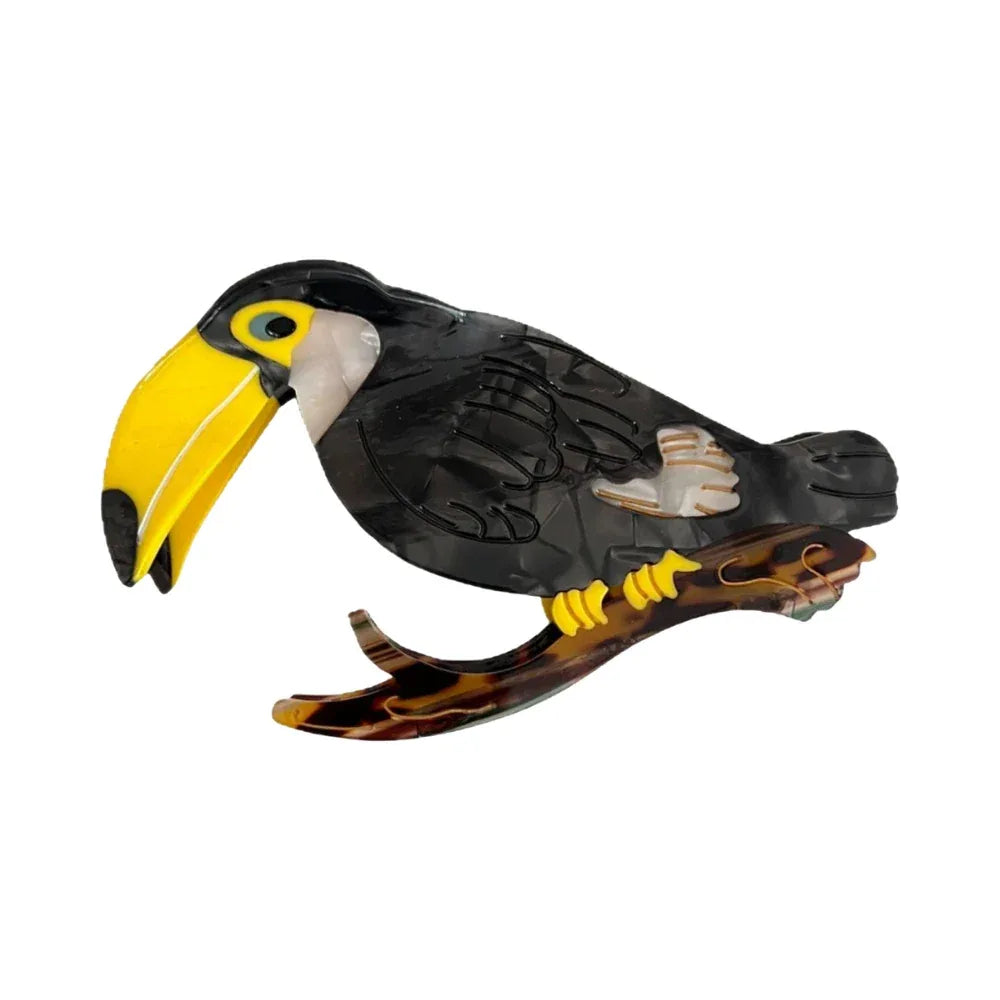 A decorative acrylic toucan perched on a branch. Main image