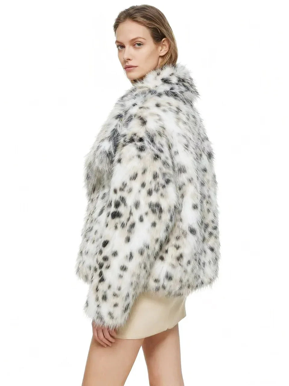 back view of a woman wearing a dalmatian print faux fur cropped jacket