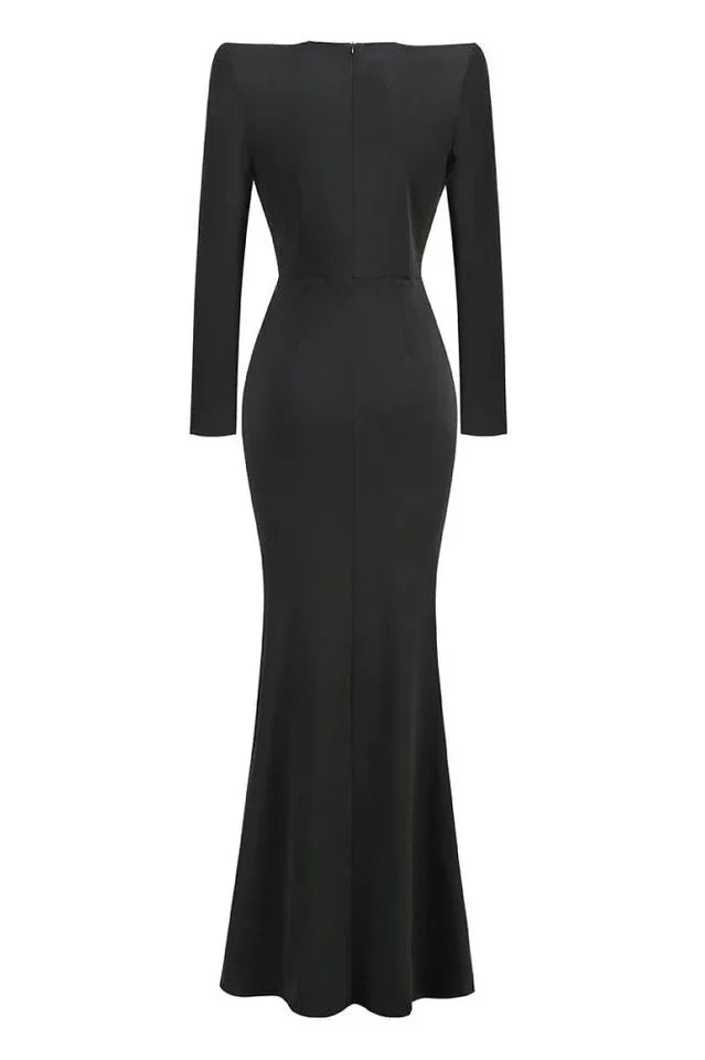 Back view of a long black formal dress with a fitted silhouette and a mermaid hem.