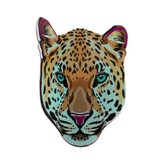 Close-up of a leopard head accessory with vibrant blue eyes and spotted fur