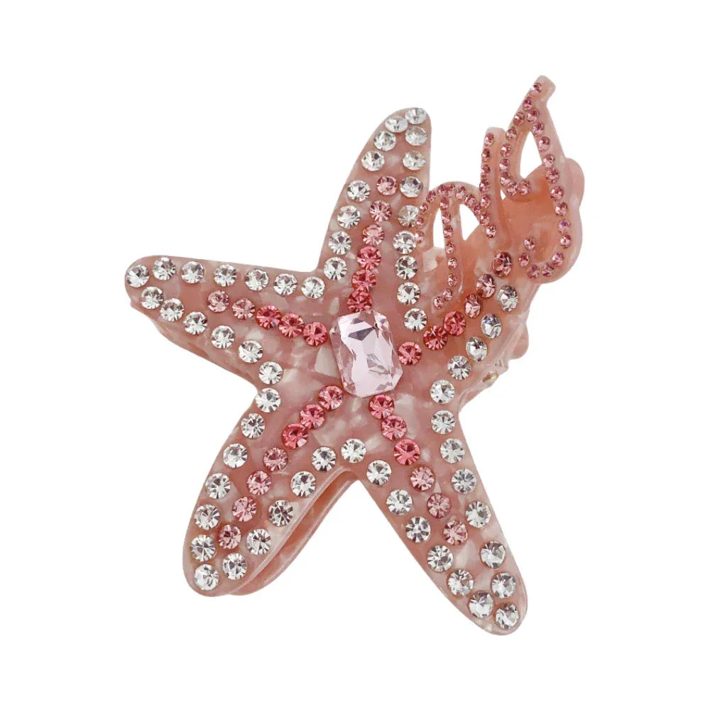 Close-up of a pink rhinestone-embellished starfish hair claw clip Main image
