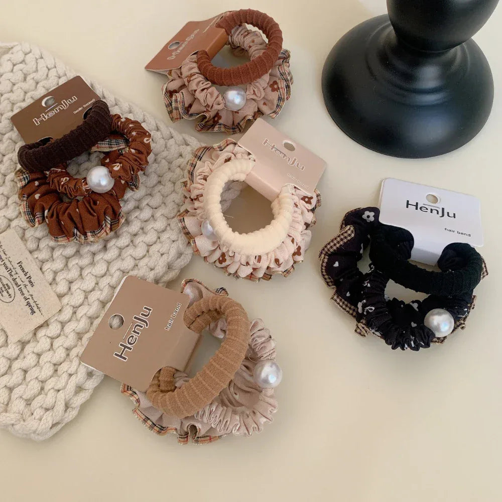 Collection of scrunchies with various patterns and pearl details