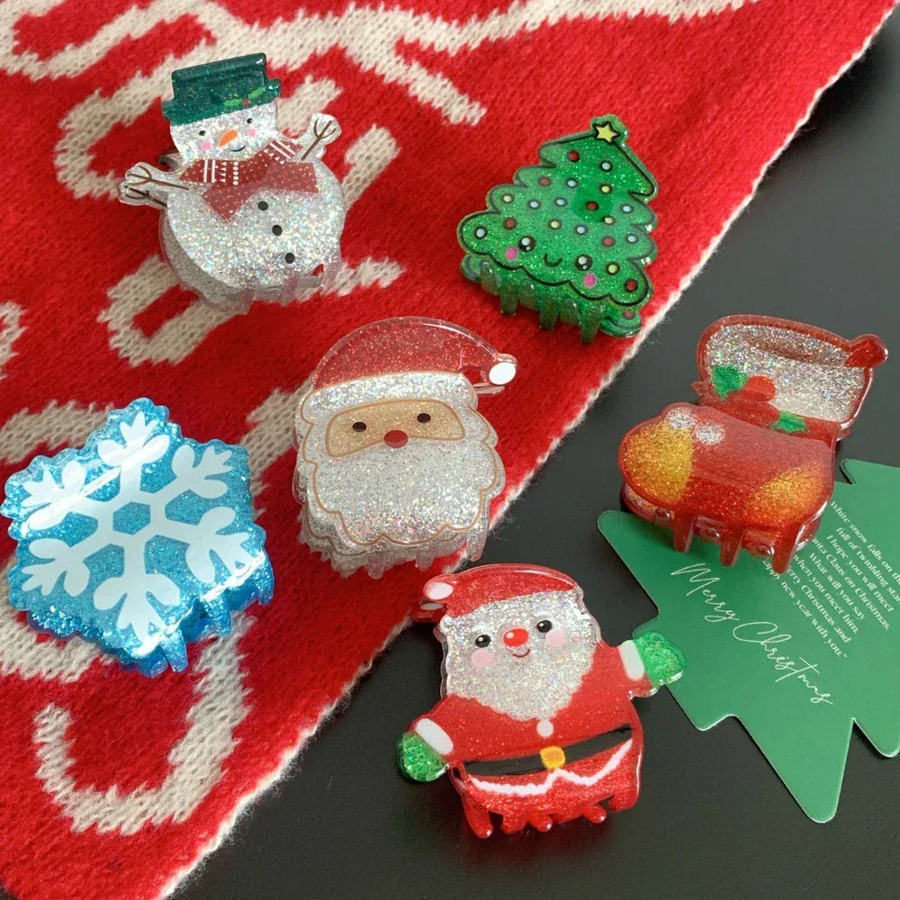 Assorted glittery Christmas hair accessories arranged on a festive background