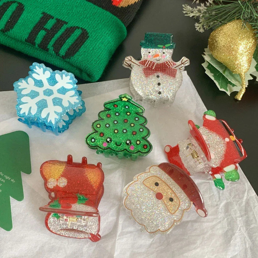 Various glittery Christmas hair claw clips including Santa, snowman, Christmas tree, and snowflake