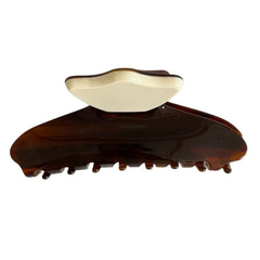 A tortoiseshell and cream hair claw clip