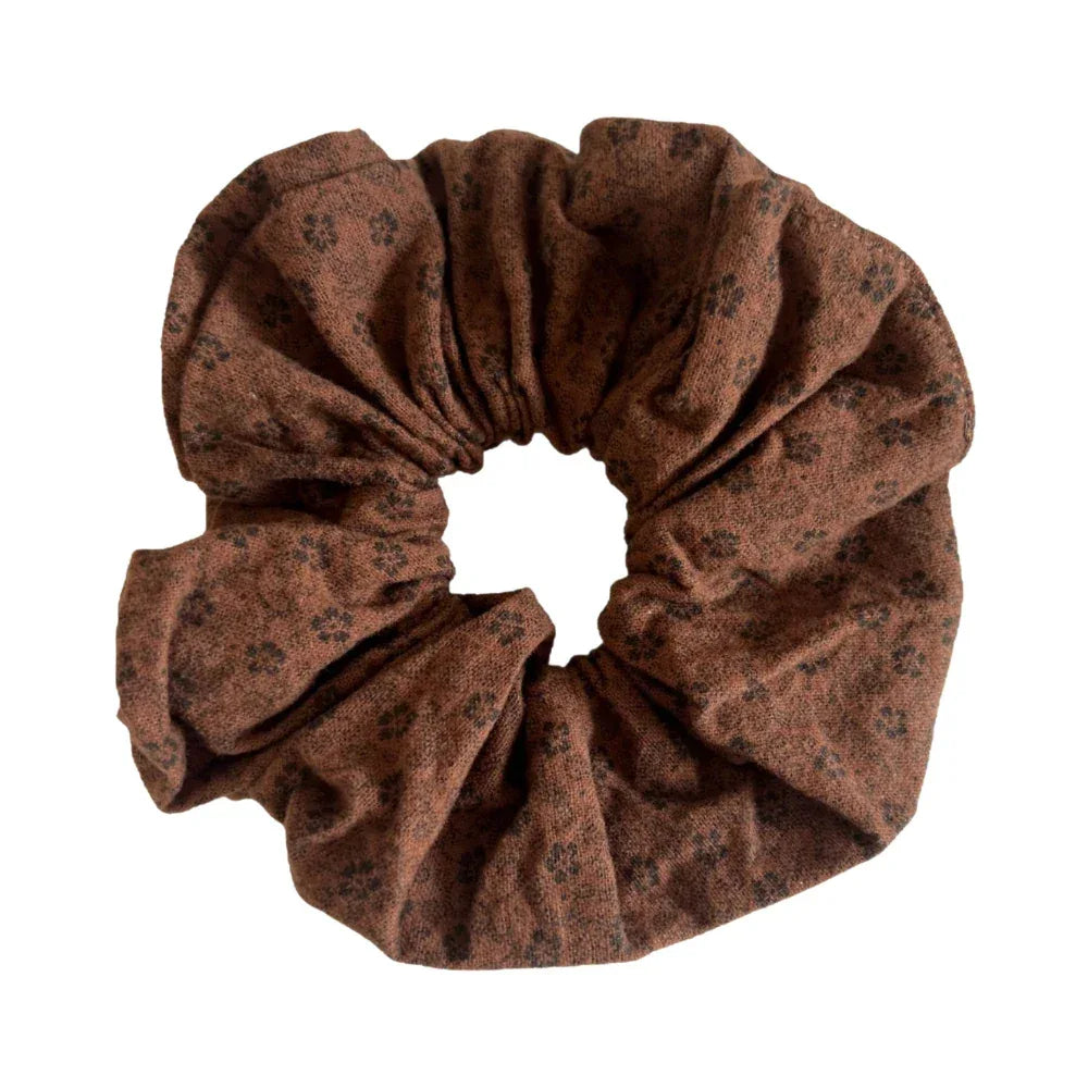 brown scrunchie with a floral pattern