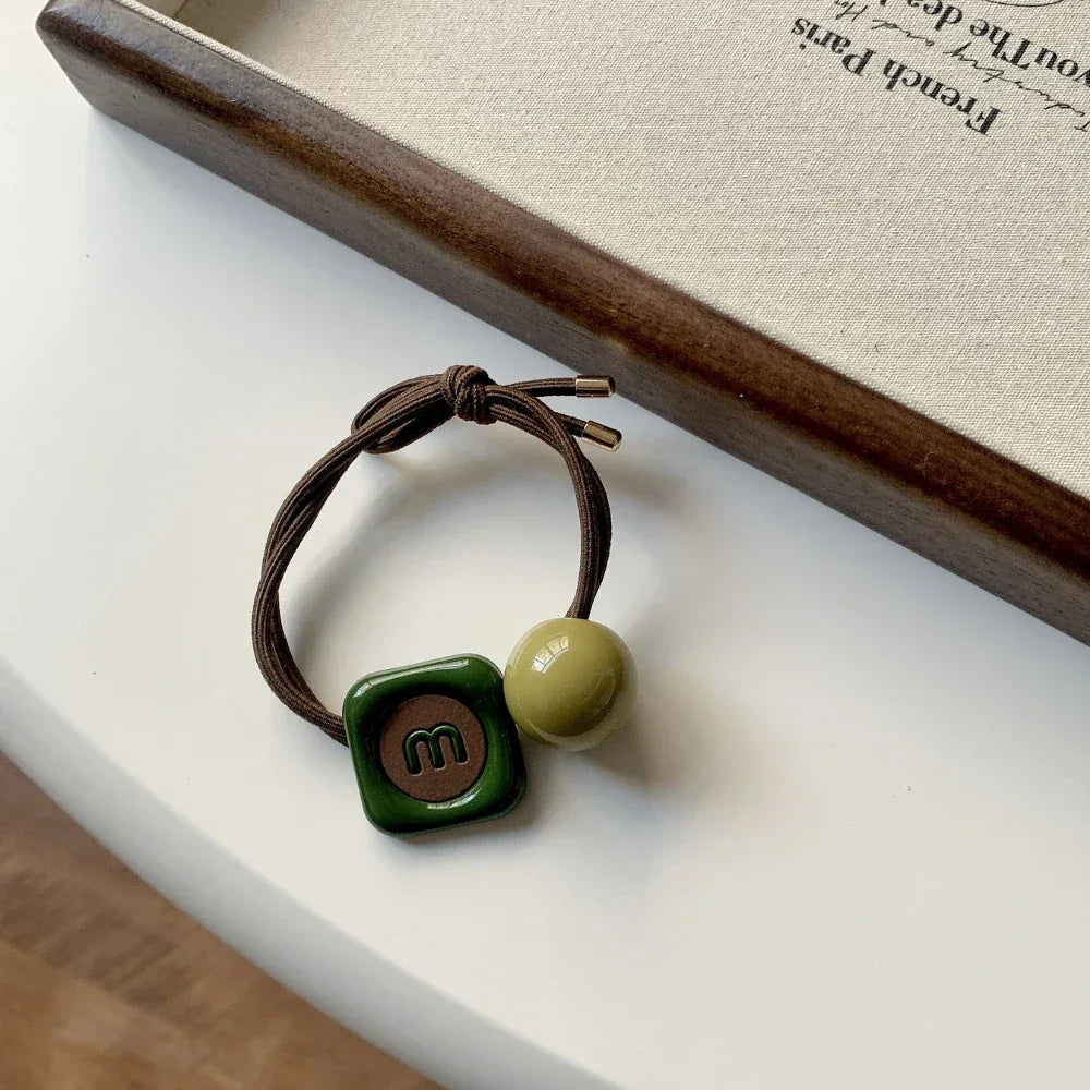 Decorative double-strand hair tie with retro green acrylic beads and a choice of charms - View 9 | TEVQA