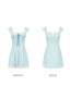 Front view of a light blue and white striped mini dress with a corset bodice and ribbon detail