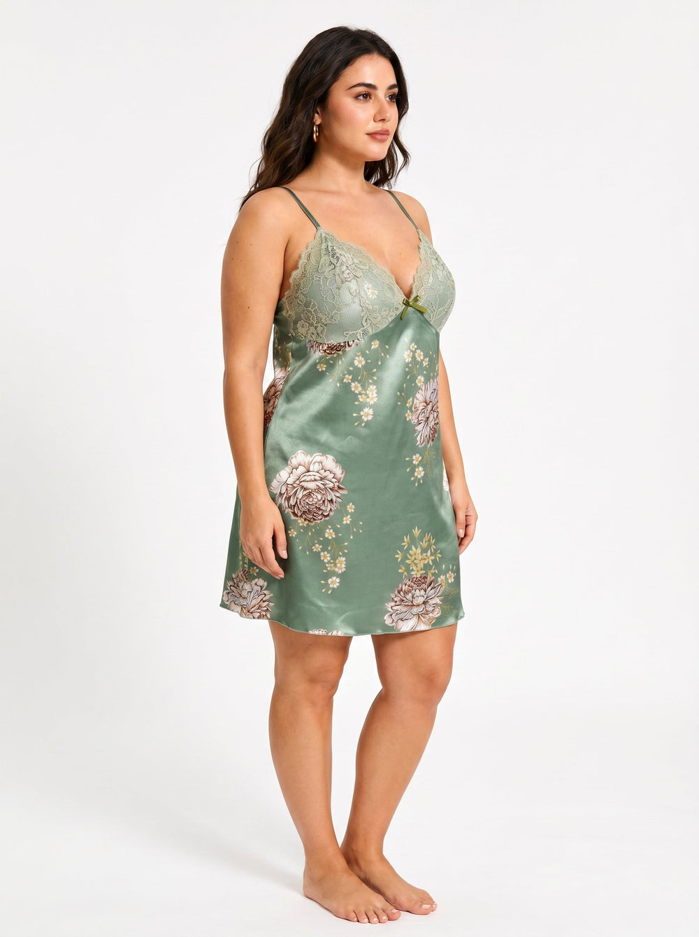 Side view of a plus-size model in a green satin floral print chemise