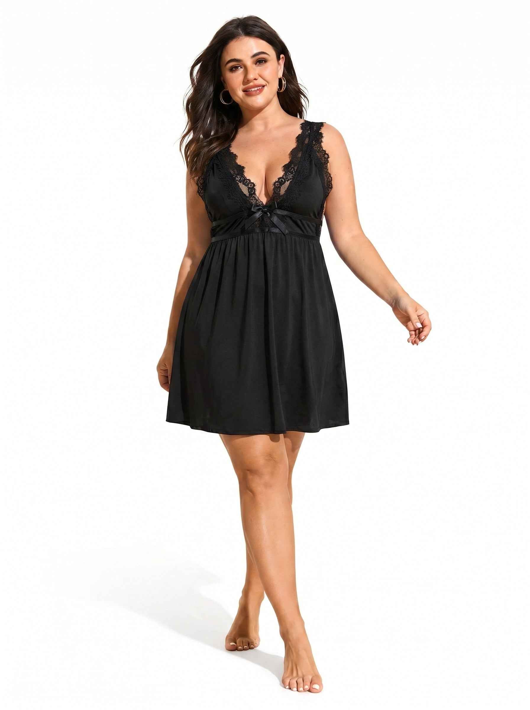 Woman wearing a black lace-trimmed babydoll nightgown with hair blowing