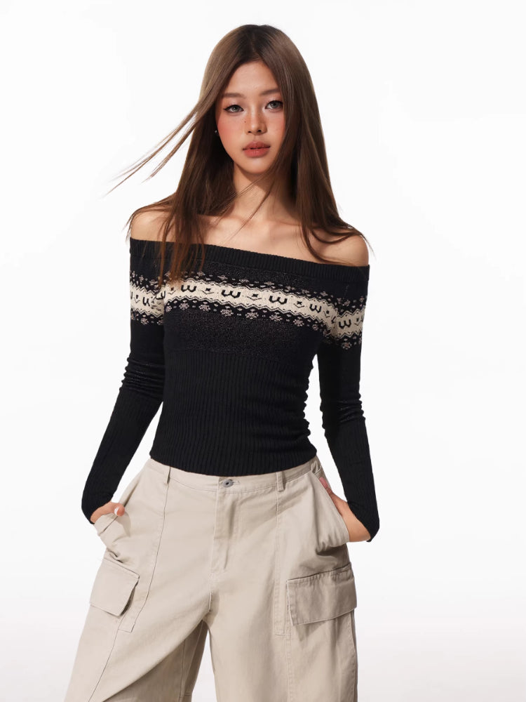 Front view of a woman in a black off-the-shoulder sweater with Fair Isle detail and beige cargo pants.