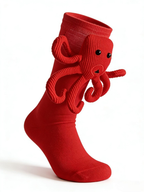 Red sock with a red octopus applique, shown from the side against a white background