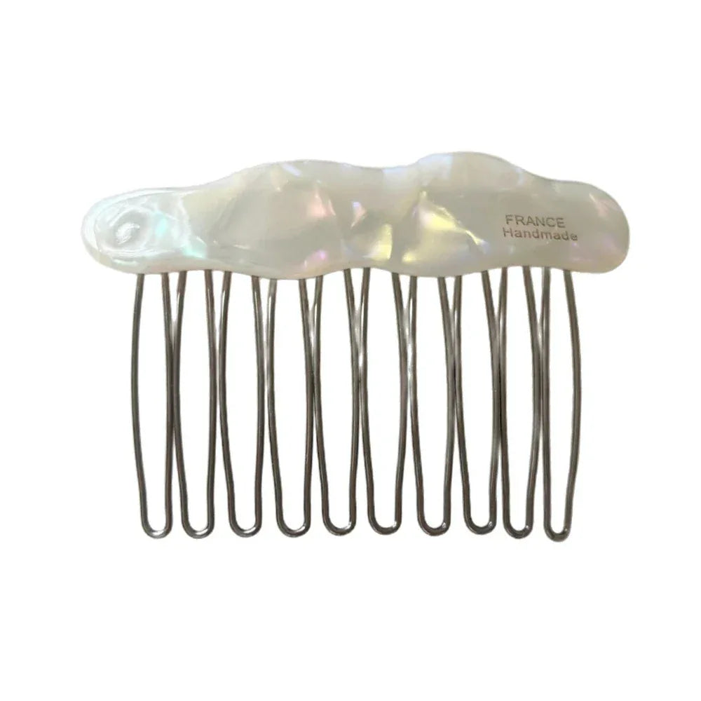 A white iridescent cloud-shaped hair comb with metal teeth, labeled 'FRANCE Handmade'.