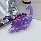 purple acrylic dinosaur hair clip with red spots