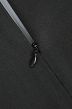 Close-up of a black zipper closure on a formal dress.