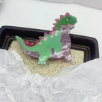 green and pink acrylic dinosaur hair clip