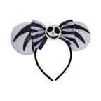 Jack Skellington inspired Mickey Mouse ear headband with black and white stripes and sequins.